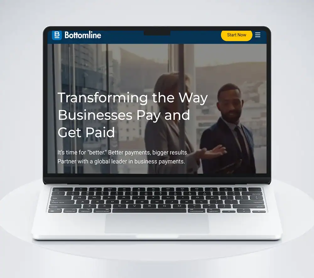 Laptop screen showing Bottomline's business payments website.
