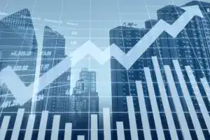 Graph with upward trend overlaid on city skyline, symbolizing financial recovery and cost-cutting strategy.