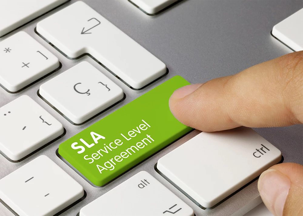 A keyboard with a green button that reads “SLA Service Level Agreement”.